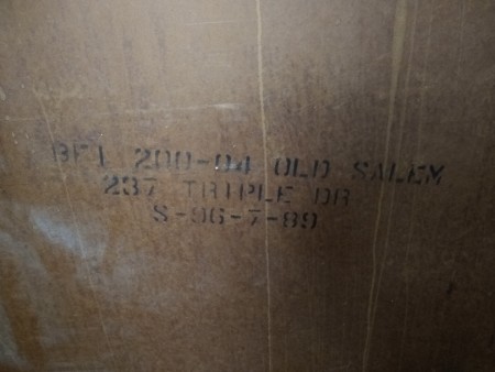 Markings on the back of a dresser.