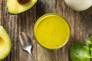 A batch of avocado dressing in a jar.