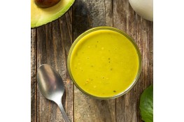 A batch of avocado dressing in a jar.