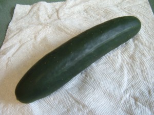 A cucumber on a paper towel.