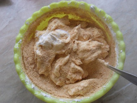 Mixing the whipped cream with the biscuit mix.