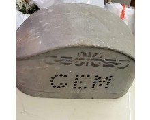 A small metal item resembling a box with the word "GEM" on the side.