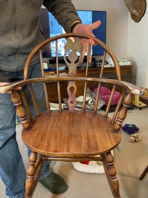 The wooden rocking chair from the front.