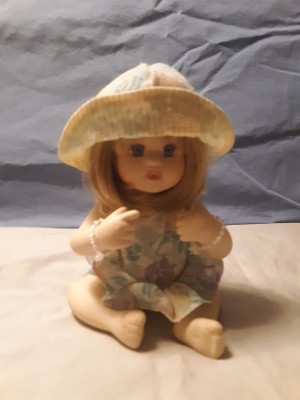 A small porcelain figurine.