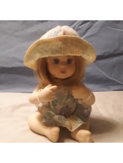 A small porcelain figurine.
