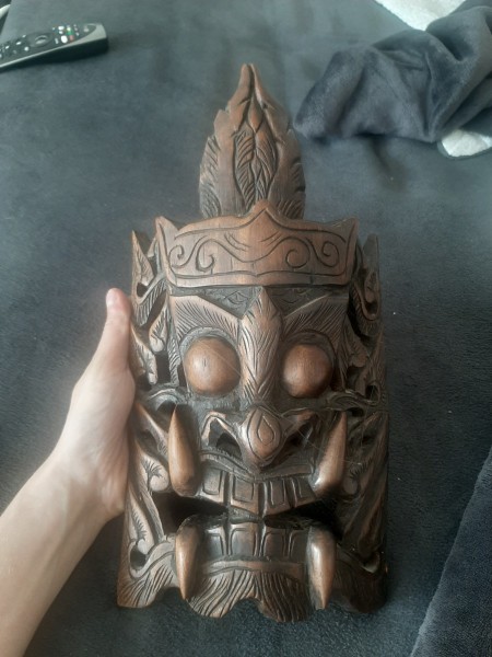 A decorative wooden mask.