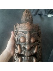 A decorative wooden mask.