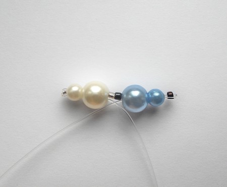 Adding beads to fishing line.