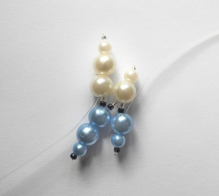 Adding beads in a pattern to fishing line.