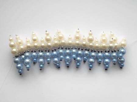 Creating a beaded bracelet with fishing line.