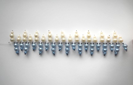 Creating a beaded bracelet with fishing line.