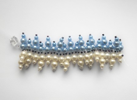 Creating a beaded bracelet with fishing line.