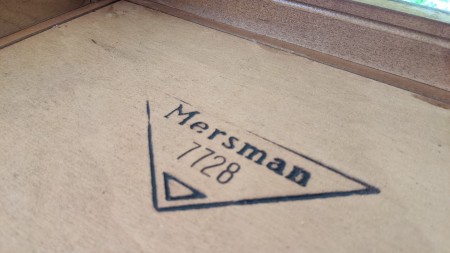 The Mersman marking on the underside of a table.