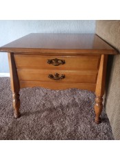A two drawer Bassett end table.