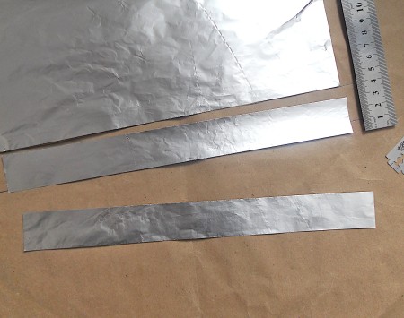 Sections of straight aluminum foil.