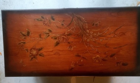 The painted top of a Lane cedar chest.