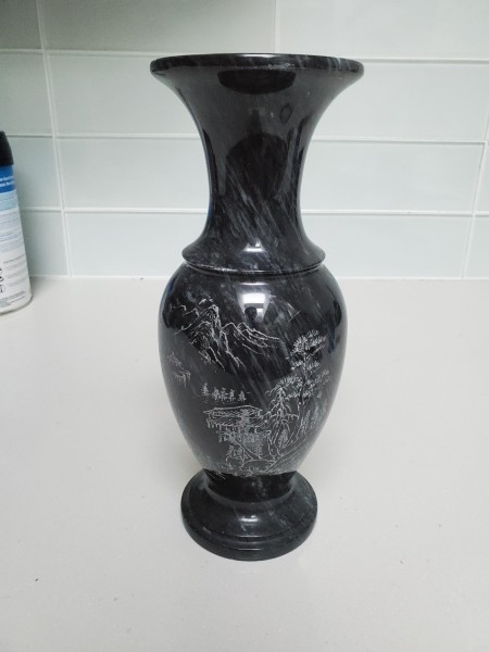 A tall marble stone vase.