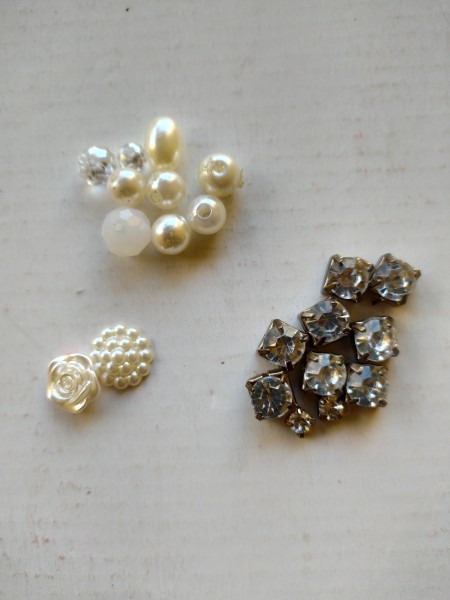 Pearls and rhinestones to be added to the earrings.