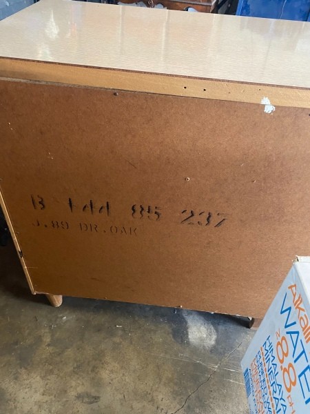 The numbers on the back of a dresser.