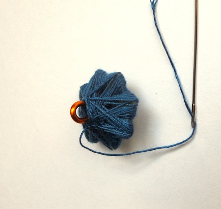 Wrapping thread around the star shape.