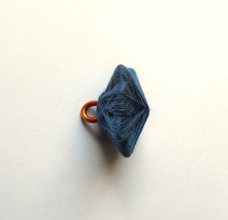 Wrapping thread around the star shape.