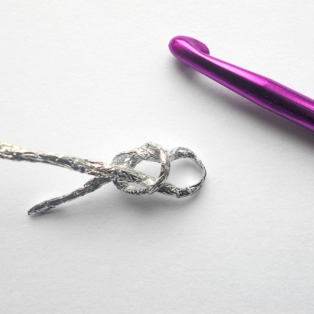 Crocheting the foil twist in a pattern.