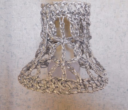 The crocheted foil cylinder.