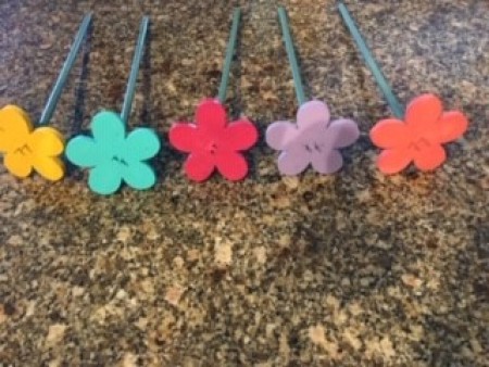 The brightly painted daisy flowers.