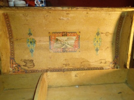 The inside of an old wooden chest.