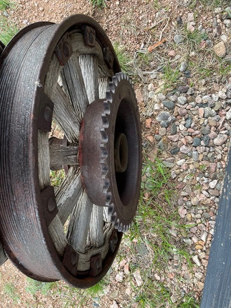 A metal wheel with gears.