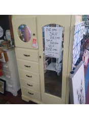 A vintage chifferobe with mirrors.