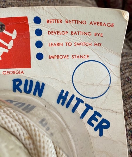 A baseball toy with Hank Aaron's signature.