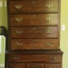 A tall wooden chest of drawers.