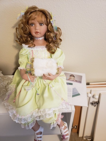 A collectible porcelain doll.