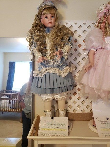 A collectible porcelain doll.