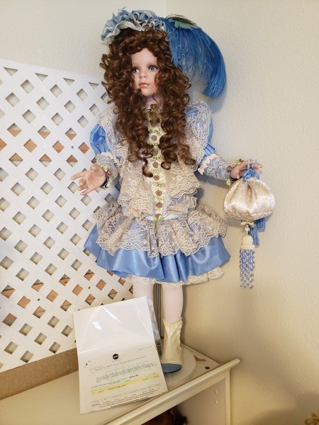 A collectible porcelain doll.