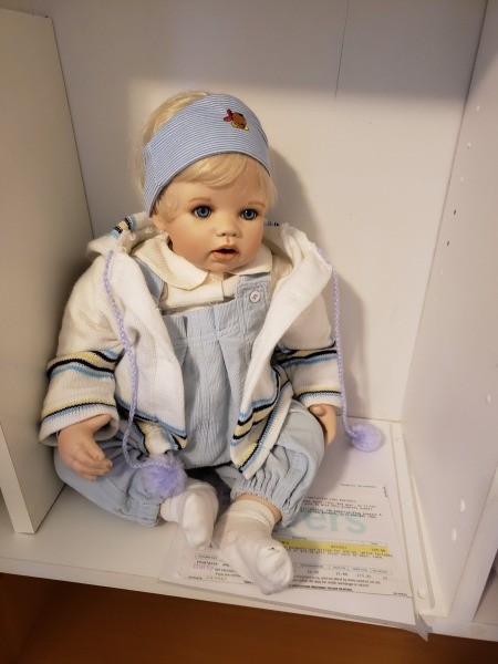 A collectible porcelain doll.