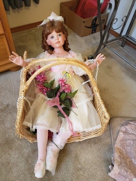 A collectible porcelain doll.