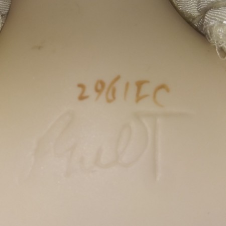 The marking on the back of a bridal doll.