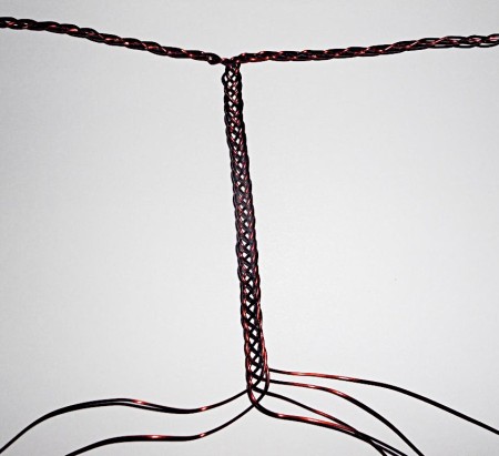 Braiding copper wire to make a handle.