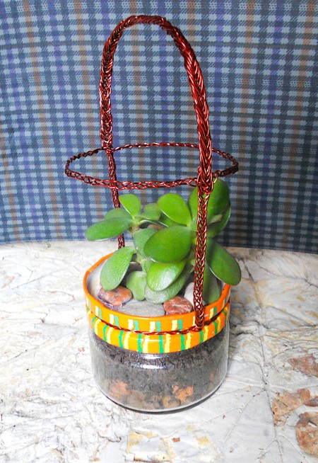 Braiding copper wire to make a handle.