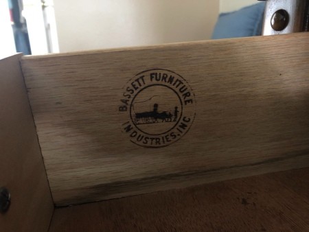 The Bassett furniture logo inside a drawer.