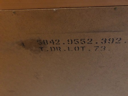 The markings on the back of a piece of furniture.