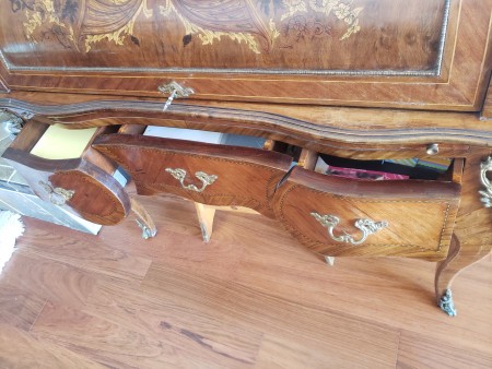 The open drawers on a desk.