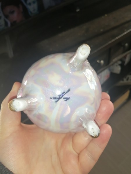 The bottom of a decorative china vase.