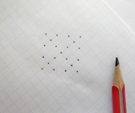 Creating a square cross pattern on paper.