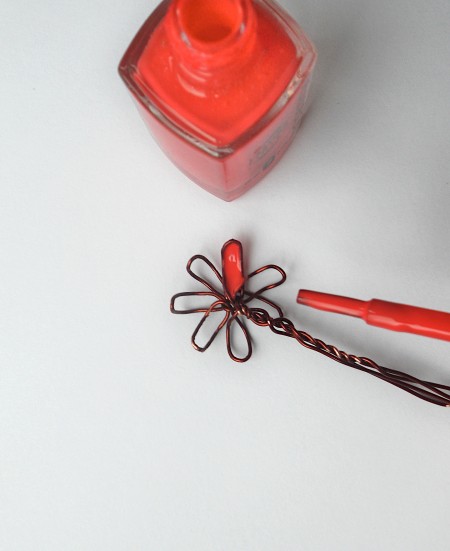 Painting the petals with nail polish.