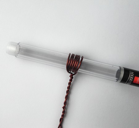 Wrapping wire around a pen.
