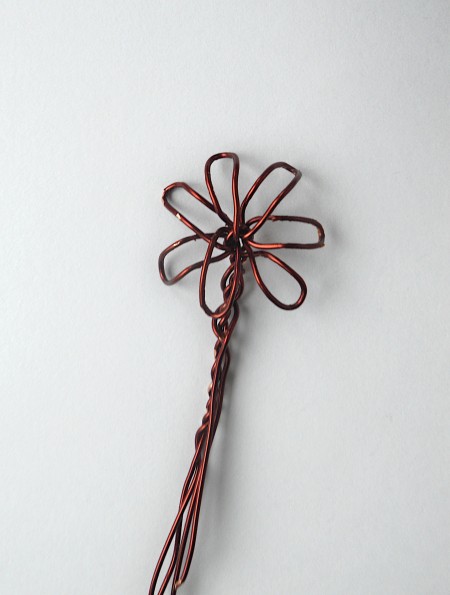 Spreading out the petals of the flower.
