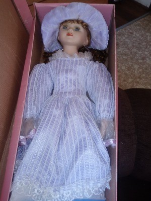 A porcelain doll, still in the original box.